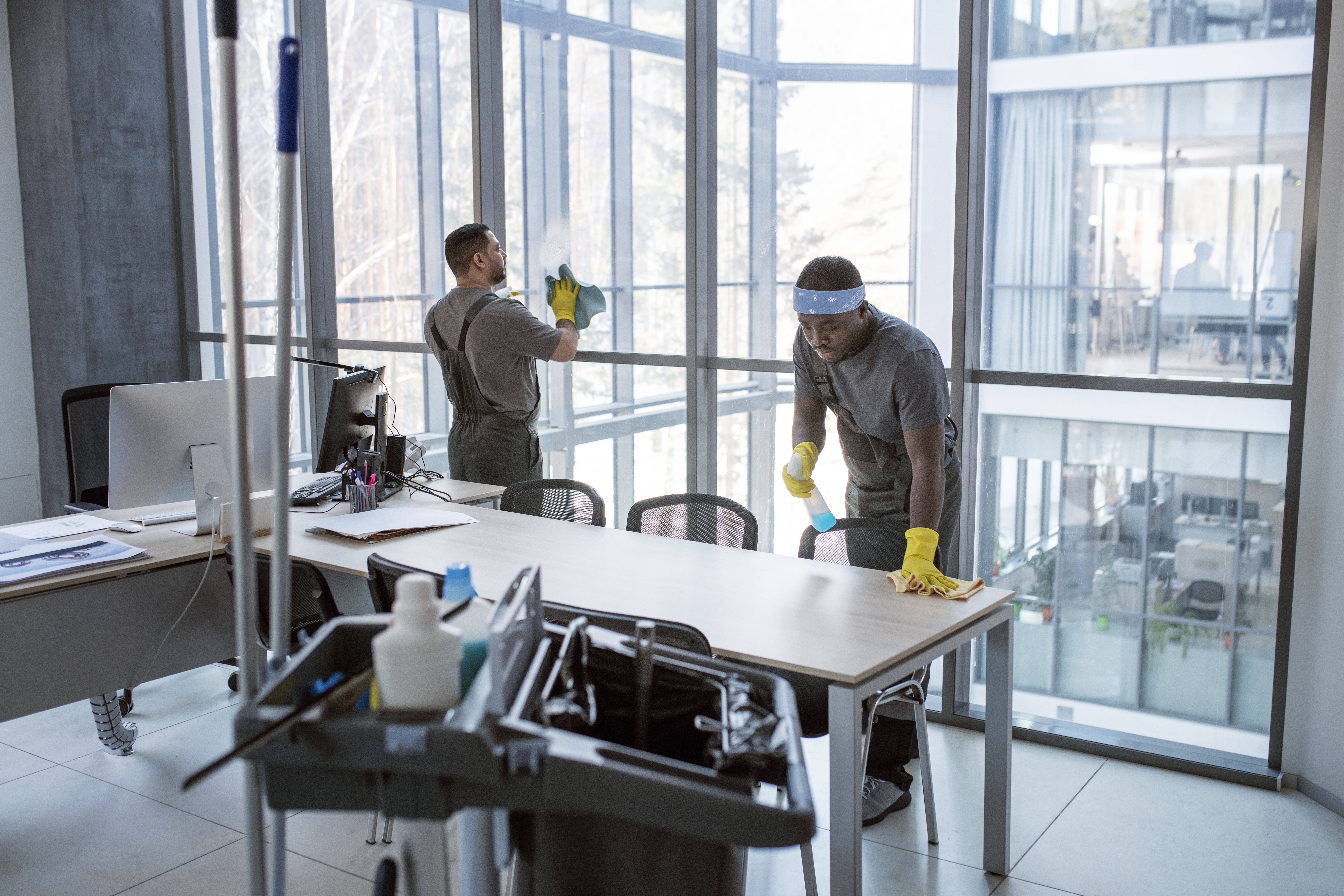 Clean office workspace with tidy desks and glass walls