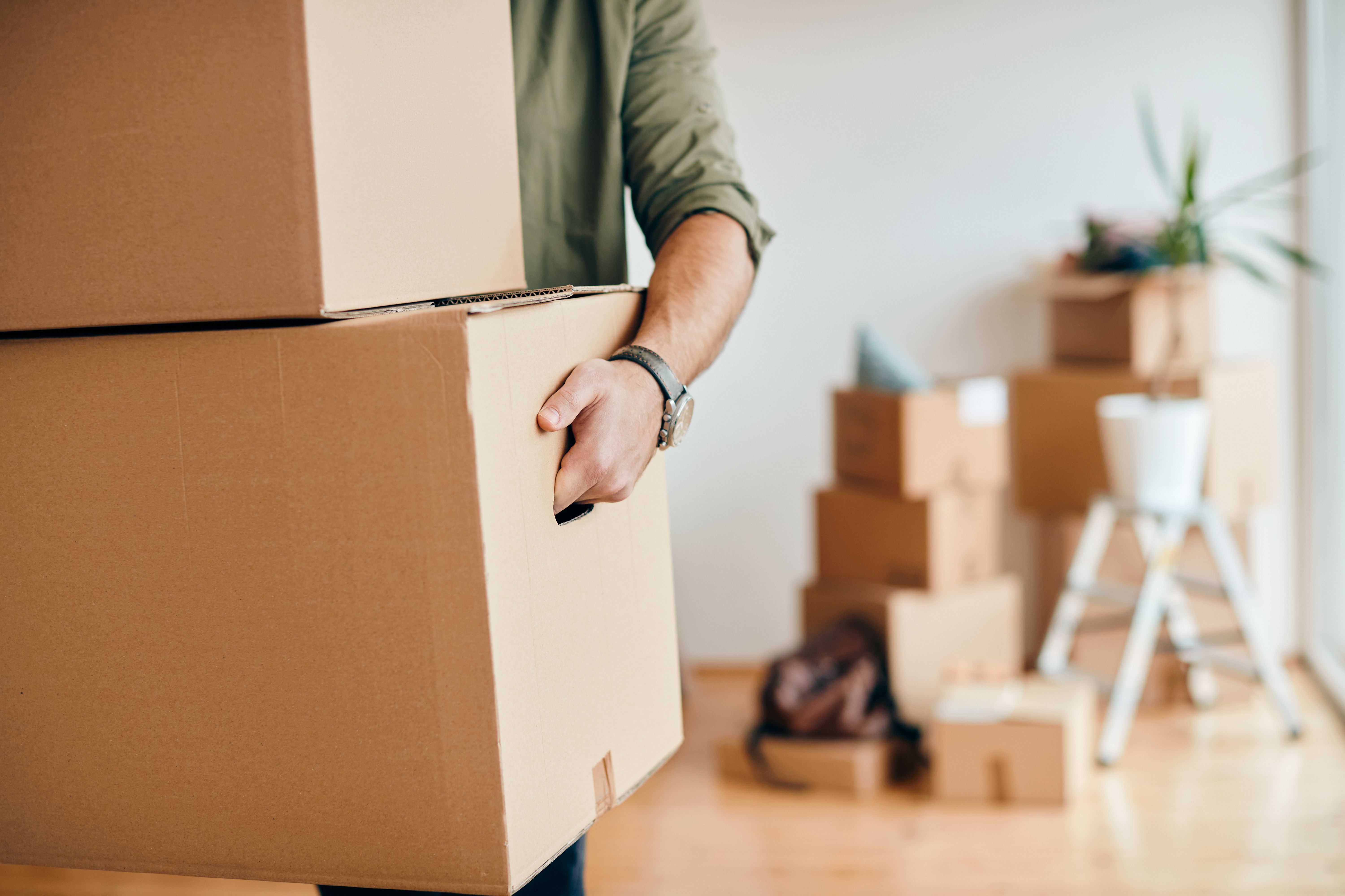 Empty bright room with moving boxes and clean floors
